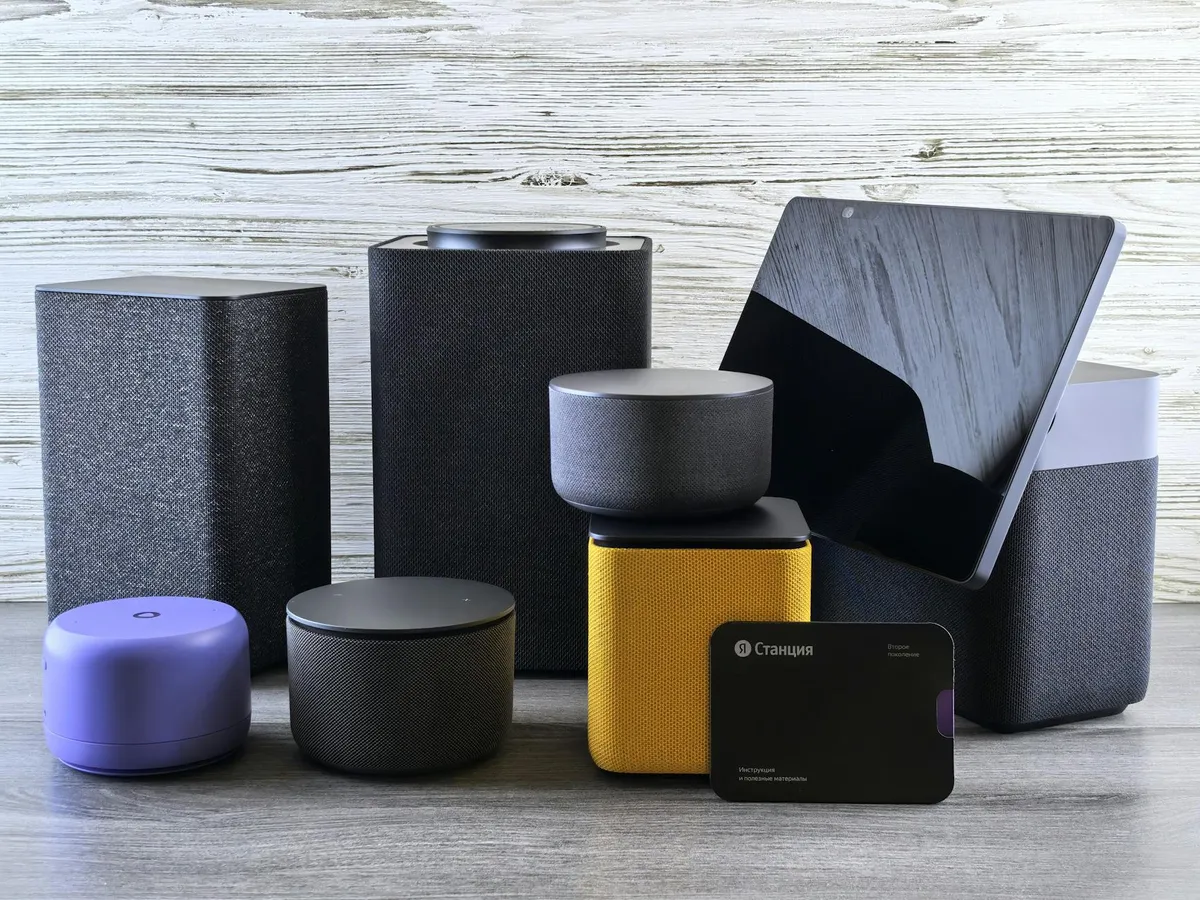 A smart speaker and smart thermostat in a modern kitchen